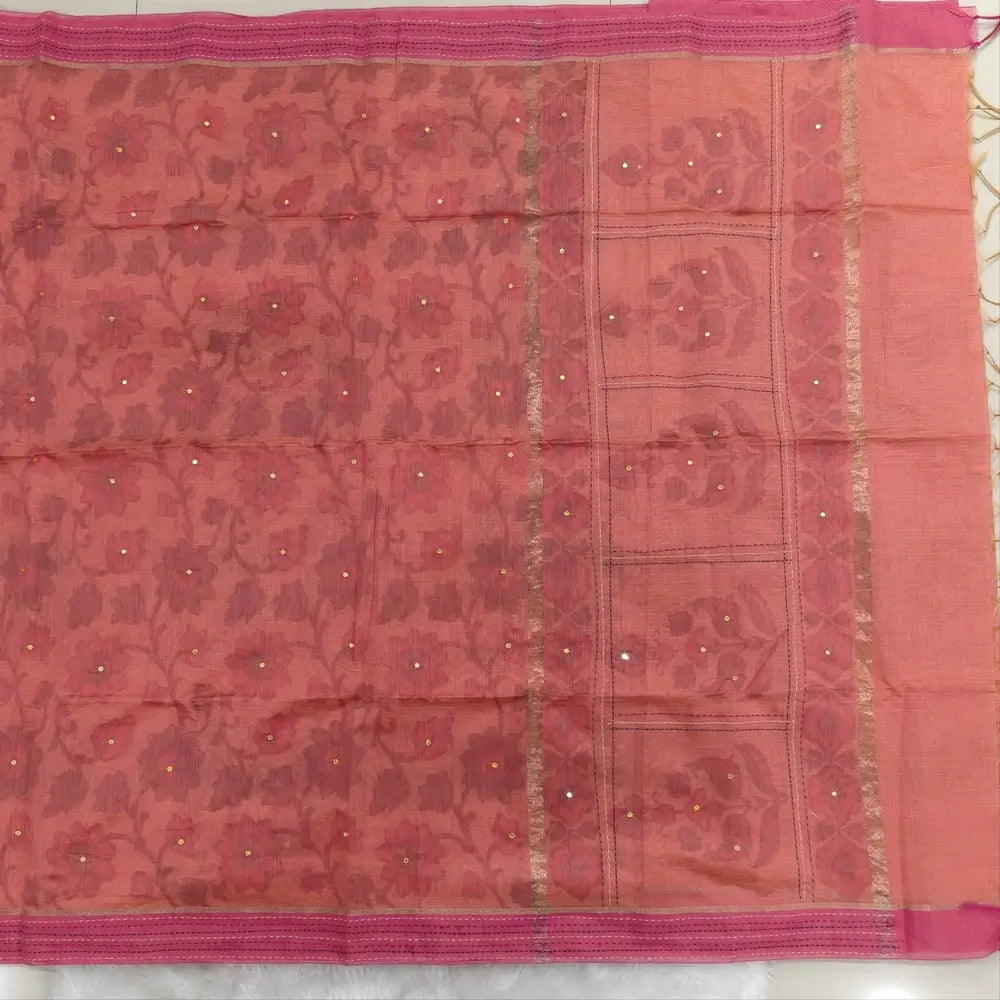 Light peachish pink with golden tint printed soft silk cotton saree (lightweight, thin, soft) double side borders with kantha stitch detailing, printed pallu with thread embroidery and simple tassels, plain running blouse with borders. NS50
