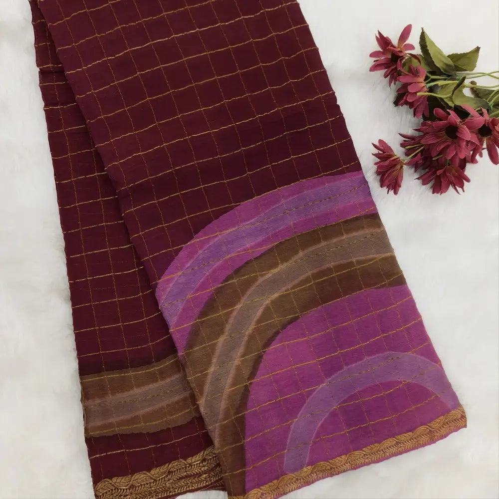 Dark Maroonish Pink Viscous Chanderi silk saree with shibori prints all over and zari checks all over, thin zari woven borders and running viscous chanderi zari woven blouse. NS56