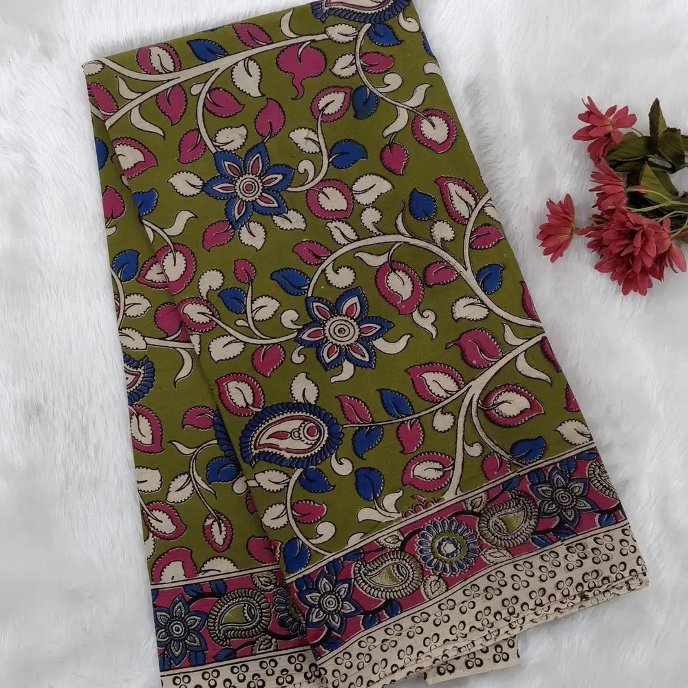 Mehandhi Green kalamkari hand block printed cotton saree, printed pallu and kalamkari printed blouse with borders. INCONSISTENT PRINTS AND DYES ARE NOT DEFECTS.NS66