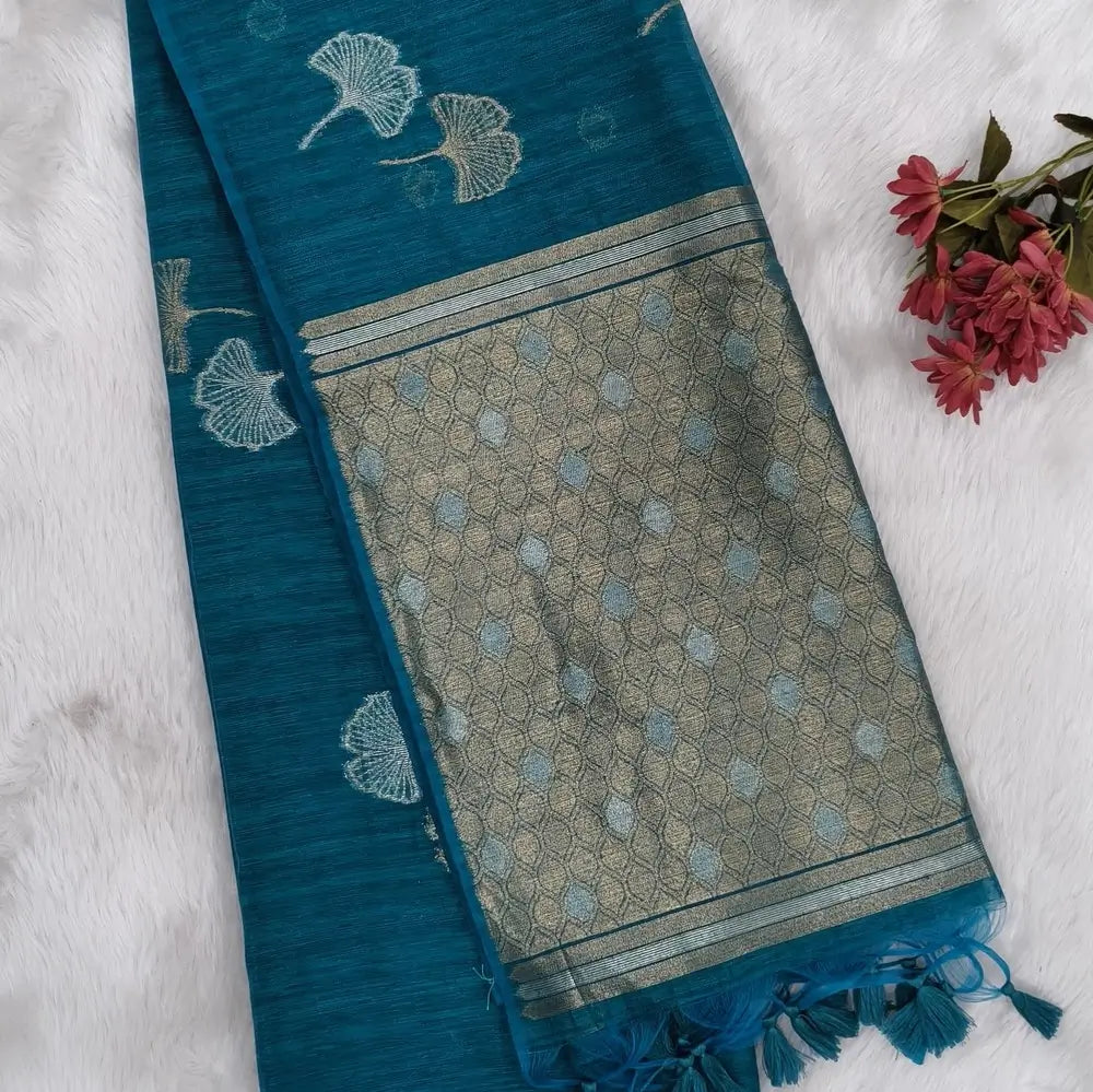 Turquoise blue premium tussar jamdani saree with gold and silver zari weaving all over, rich weaving on pallu, running blouse with zari woven buttas and borders. NS76