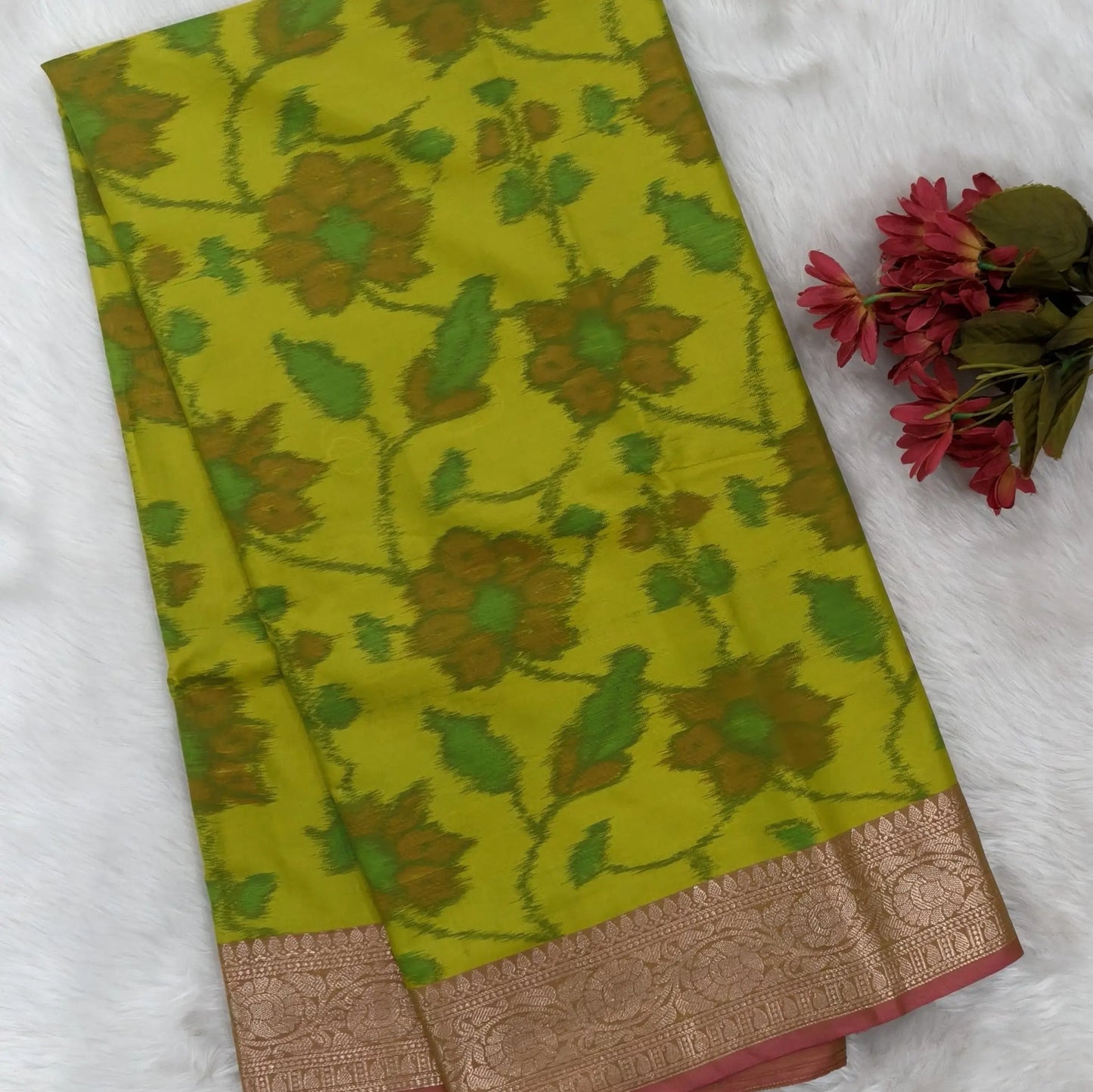 Leafy green dual shaded ikat printed soft silk saree with silver zari woven double side borders, contrast printed pallu, contrast running blouse with zari woven borders. NS98
