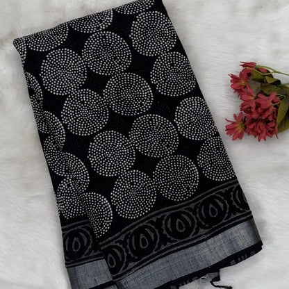 Black block printed linen cotton saree with double side silver zari borders (lightweight,soft) printed pallu with silver zari stripes, plain running blouse with borders. NS111