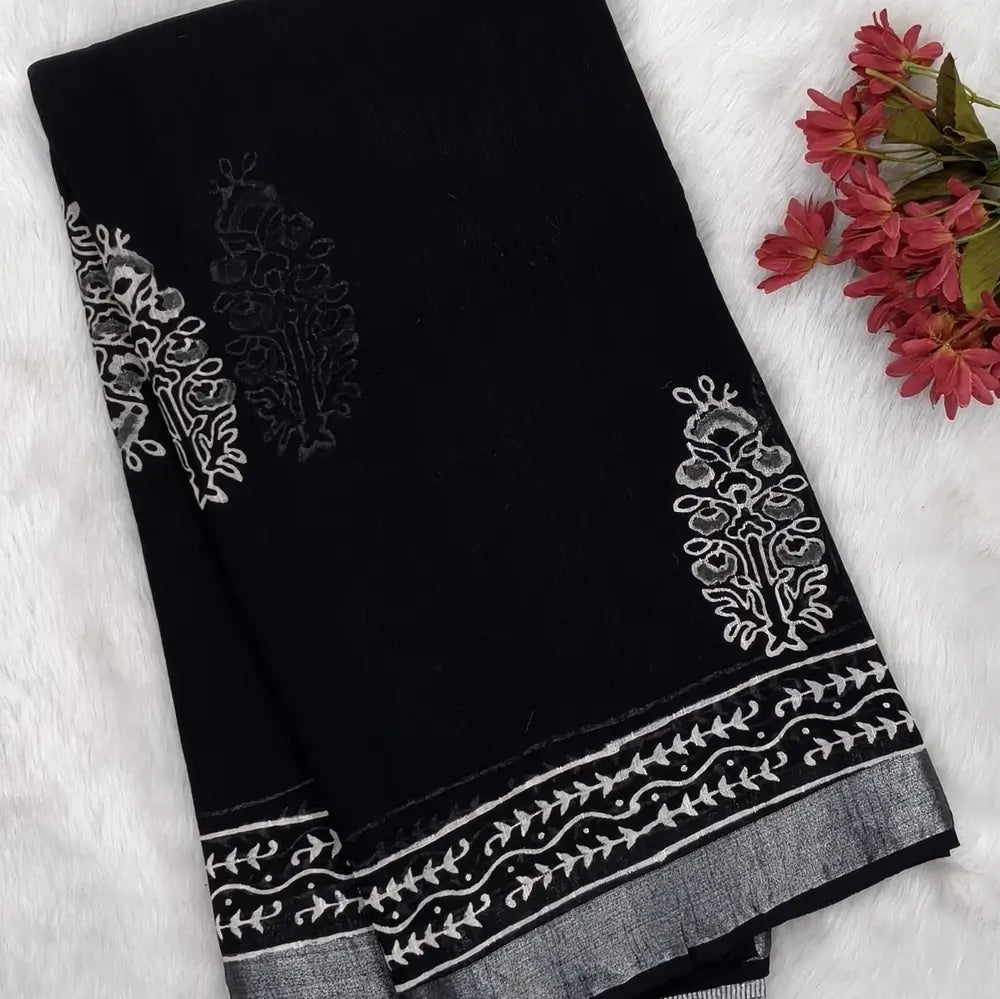 Black block printed linen cotton saree with double side silver zari borders (lightweight,soft) printed pallu with silver zari stripes, plain running blouse with borders. NS109