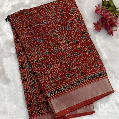 Reddish maroon ajrak hand block printed pure dola silk saree, benarasi zari woven double side borders, hand block printed pallu, running blouse with borders.(DRY CLEAN RECOMMENDED , MILD STAINS AND DYES ARE NOT DEFECTS). NS100