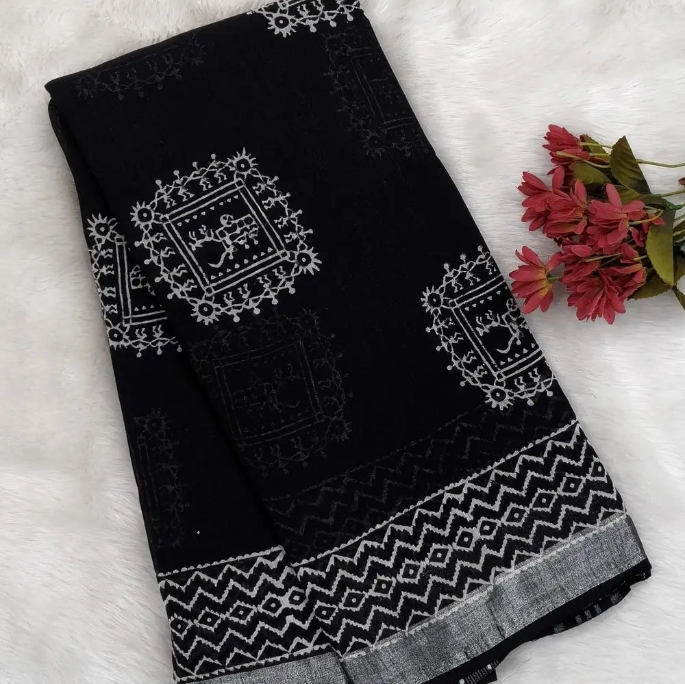 Black block printed linen cotton saree with double side silver zari borders (lightweight,soft) printed pallu with silver zari stripes, plain running blouse with borders. NS107