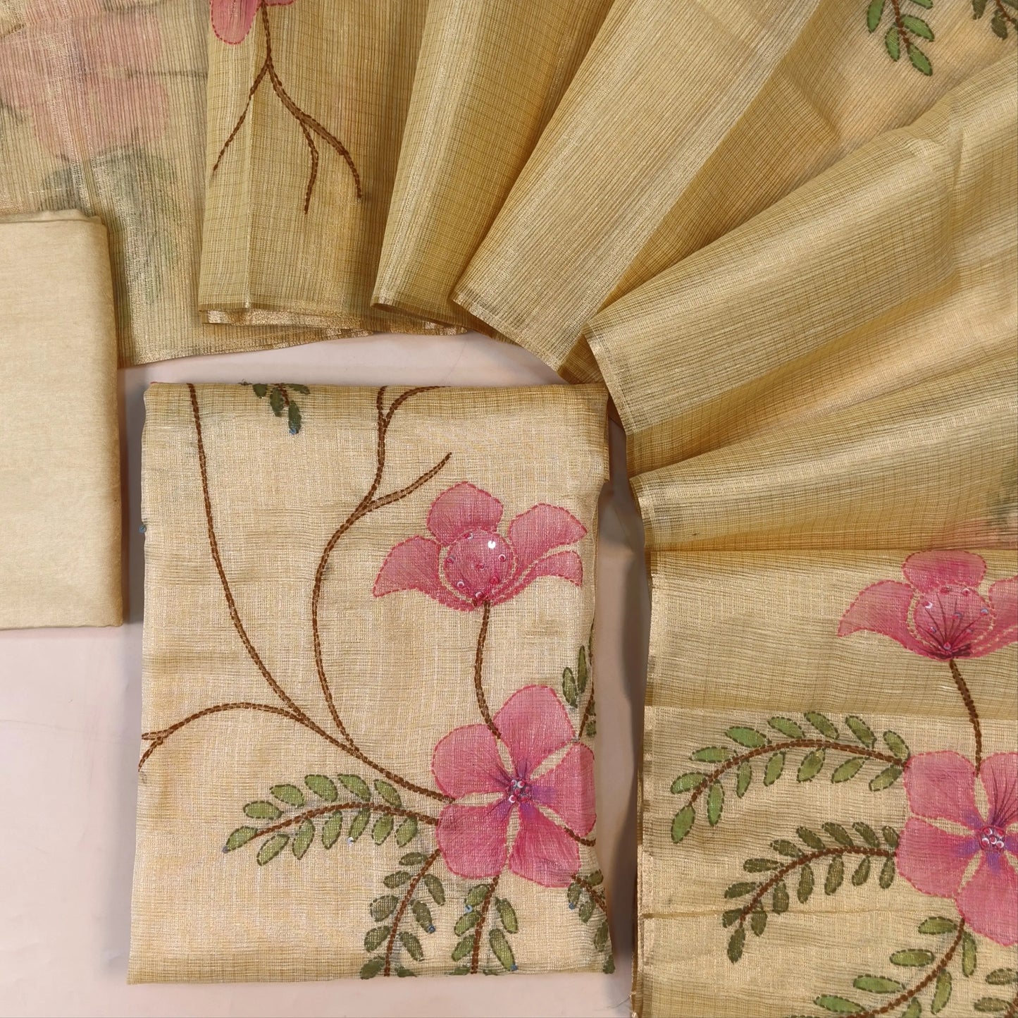 Designer Pastel Yellow golden tint tissue kota unstitched salwar material, floral design with hand brush paint, kantha stitch and sequins on front,(lining needed)santoon bottom,floral printed and brush paint on tissue kota dupatta. AG262124
