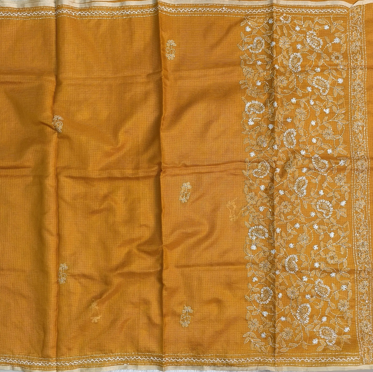 Yellow premium kota silk saree(soft, thin)with rich hand embroidery work all over,thin tissue borders,rich embroidered pallu,running blouse with embroidery and borders. NS290