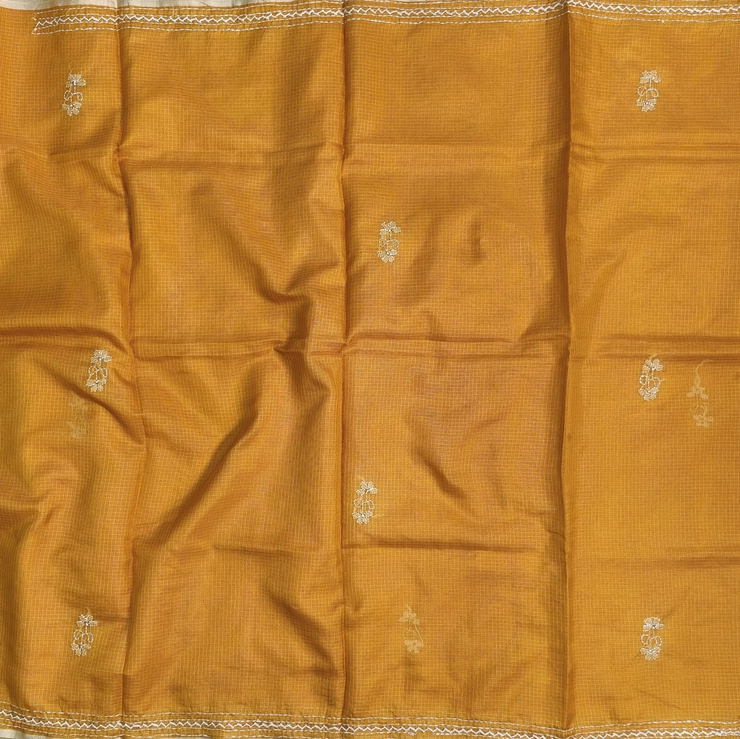 Yellow premium kota silk saree(soft, thin)with rich hand embroidery work all over,thin tissue borders,rich embroidered pallu,running blouse with embroidery and borders. NS290