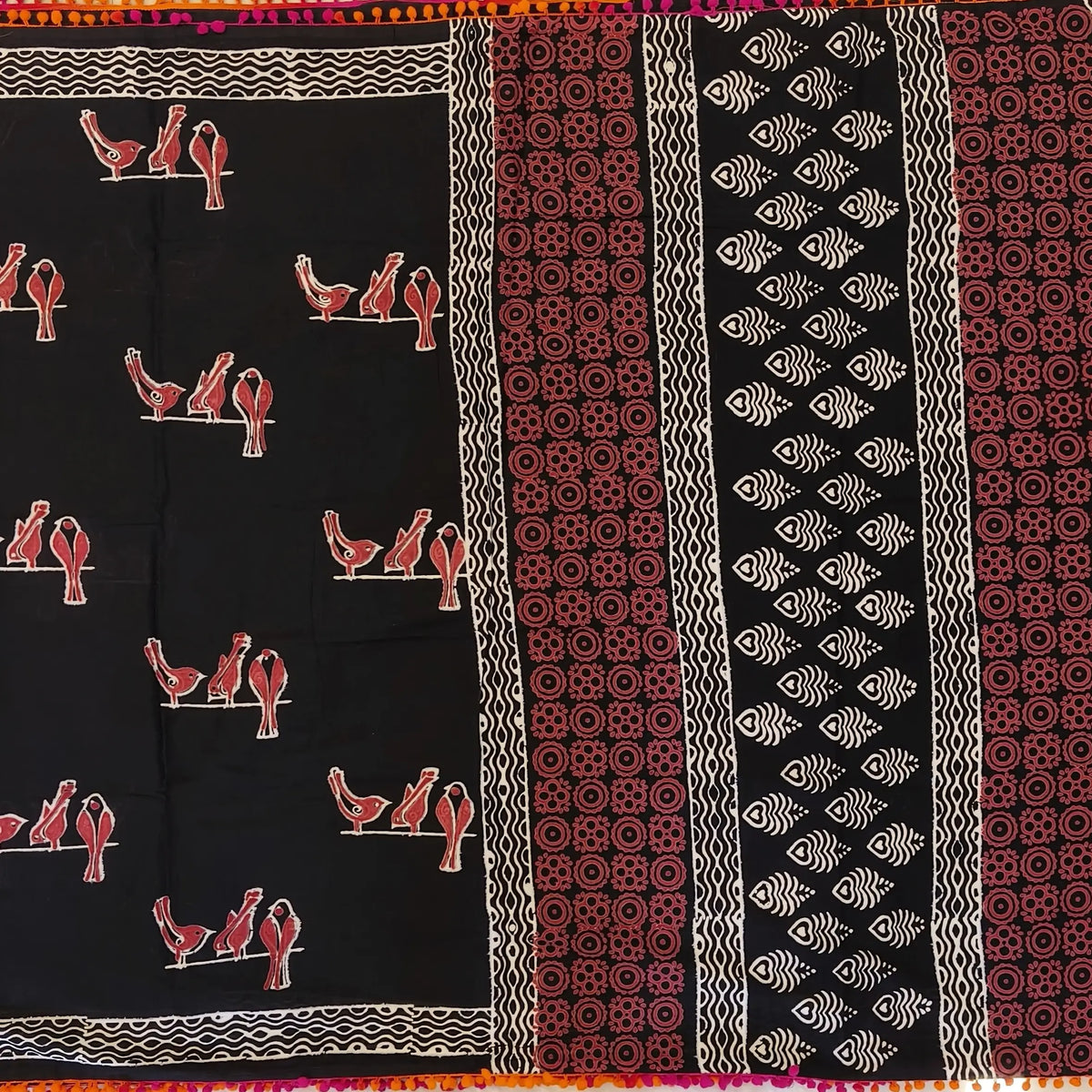 Black soft cotton printed saree with pom pom tapings (Thin, Soft)printed pallu, plain running blouse with borders. NS296