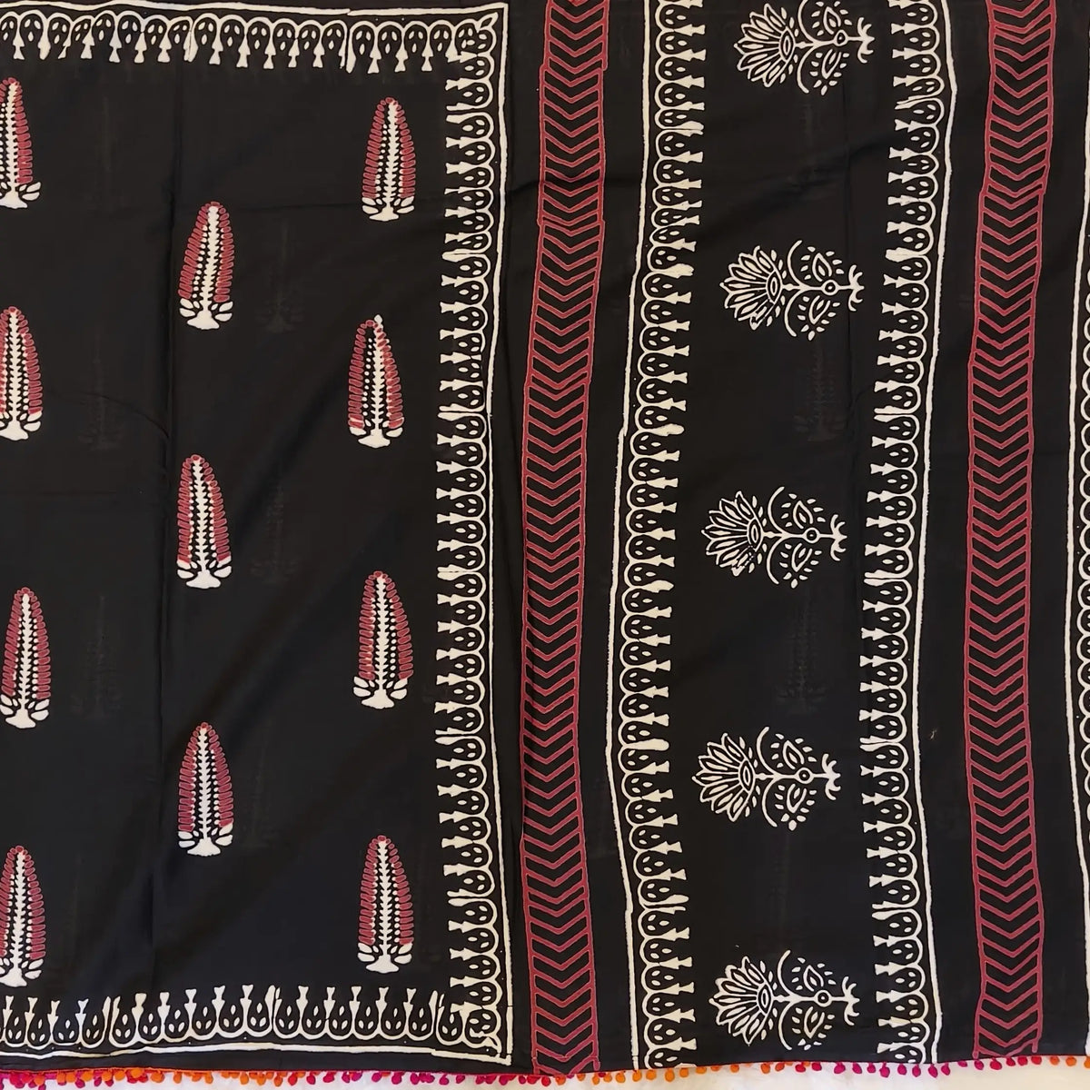 Black soft cotton printed saree with pom pom tapings (Thin, Soft)printed pallu, plain running blouse with borders. NS295