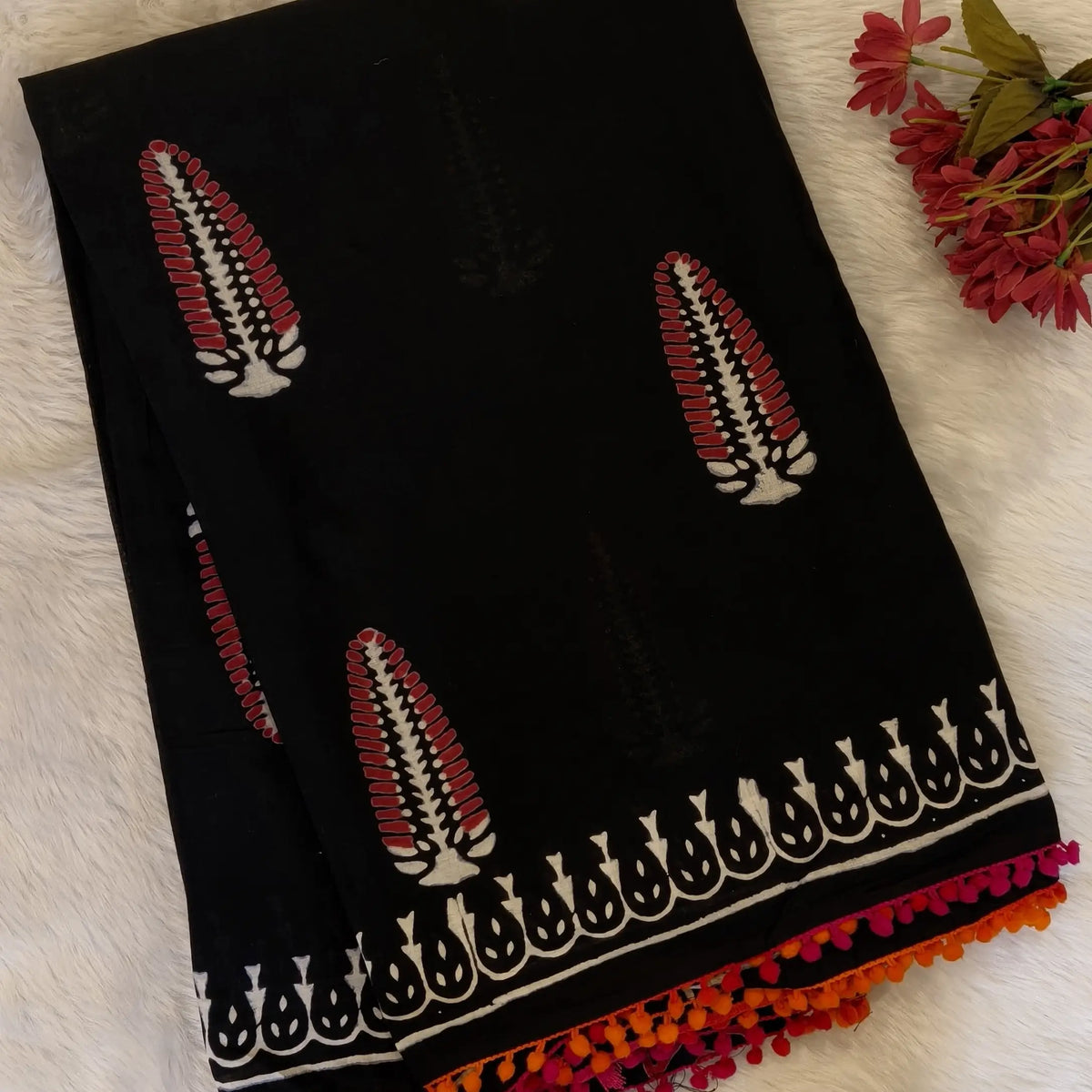 Black soft cotton printed saree with pom pom tapings (Thin, Soft)printed pallu, plain running blouse with borders. NS295