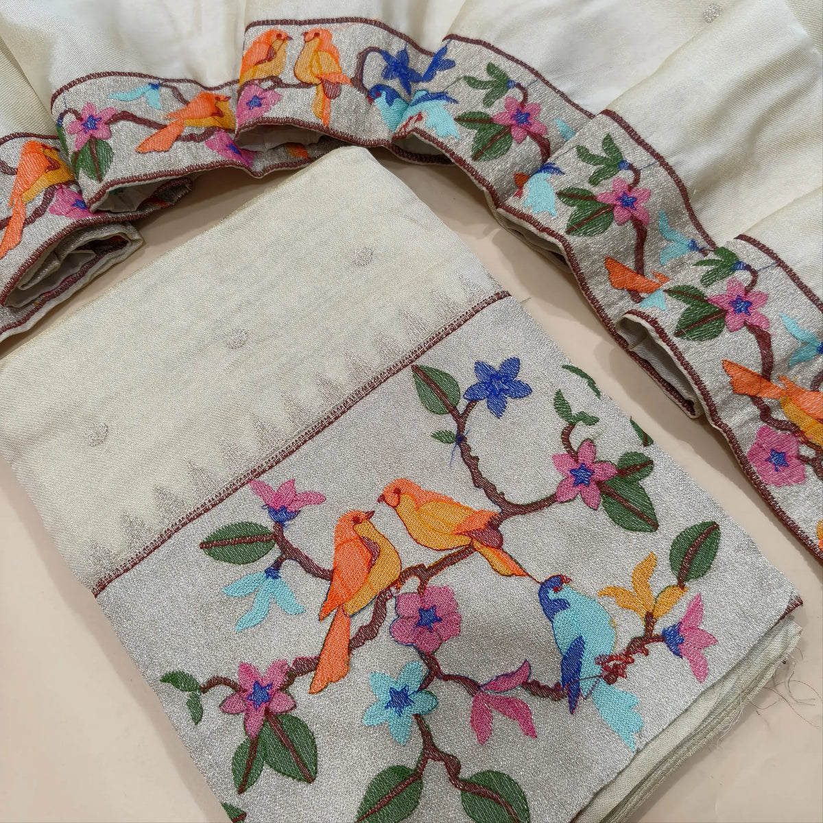 Designer off white with golden tint pure tissue organza silk unstitched salwar material, rich silver tissue daman with embroidery, silver zari buttas on front (Thin, Lining Needed)matching santoon bottom,dupatta with zari buttas and embroidery. SP261701