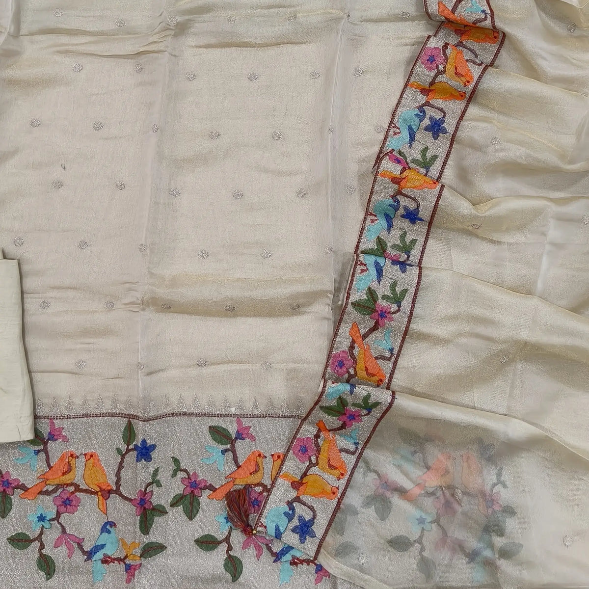 Designer off white with golden tint pure tissue organza silk unstitched salwar material, rich silver tissue daman with embroidery, silver zari buttas on front (Thin, Lining Needed)matching santoon bottom,dupatta with zari buttas and embroidery. SP261701