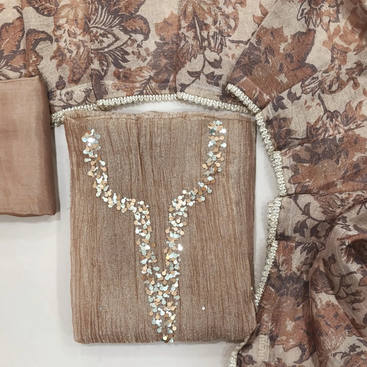 Light chocolate brown with golden tint crushed organza silk unstitched salwar material,sequins work on yoke(lining needed)santoon bottom, digital printed crushed tissue silk dupatta with fancy lace tapping. SP261803