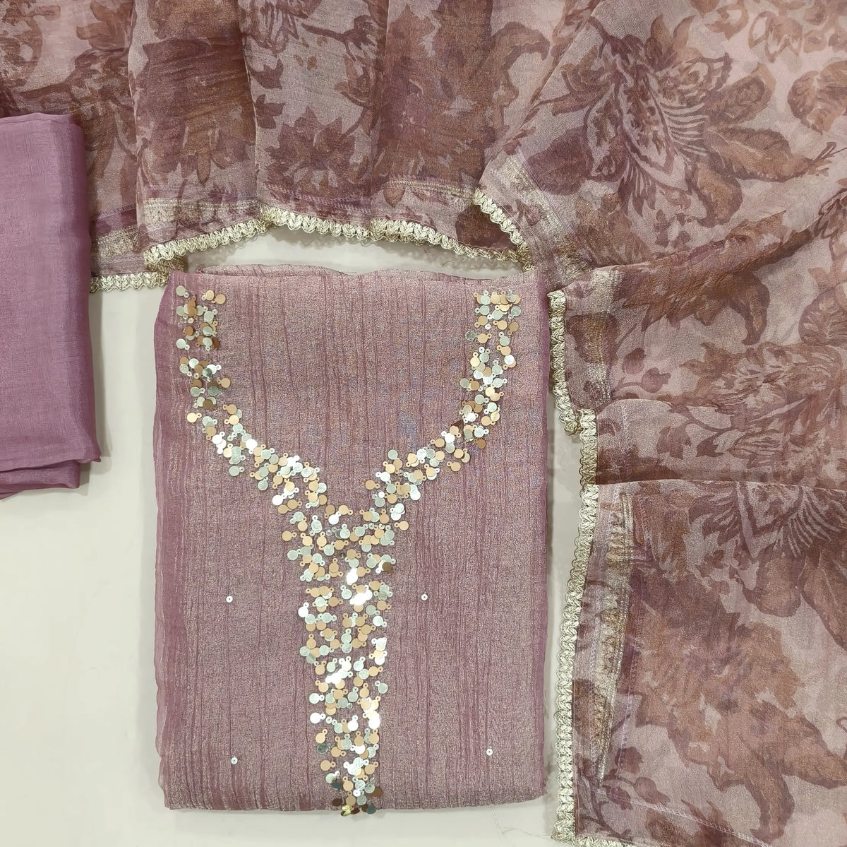 Pink with golden tint crushed organza silk unstitched salwar material,sequins work on yoke(lining needed)santoon bottom, digital printed crushed tissue silk dupatta with fancy lace tapping. SP261801