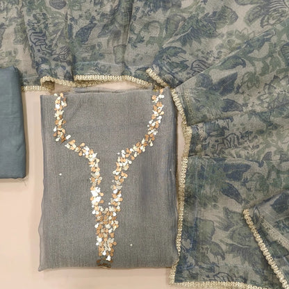Silver grey with golden tint crushed organza silk unstitched salwar material,sequins work on yoke(lining needed)santoon bottom, digital printed crushed tissue silk dupatta with fancy lace tapping. SP261802