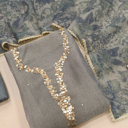 Silver grey with golden tint crushed organza silk unstitched salwar material,sequins work on yoke(lining needed)santoon bottom, digital printed crushed tissue silk dupatta with fancy lace tapping. SP261802