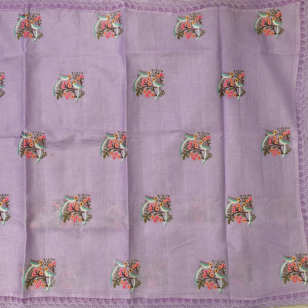 Pastel purple premium kota saree with embroidered bird and floral motifs all over (Thin, Lightweight) lace tapings as borders, rich embroidered pallu, plain running blouse. NS309