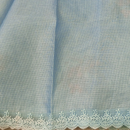 Pastel blue premium kota saree with embroidered bird and floral motifs all over (Thin, Lightweight) lace tapings as borders, rich embroidered pallu, plain running blouse. NS310