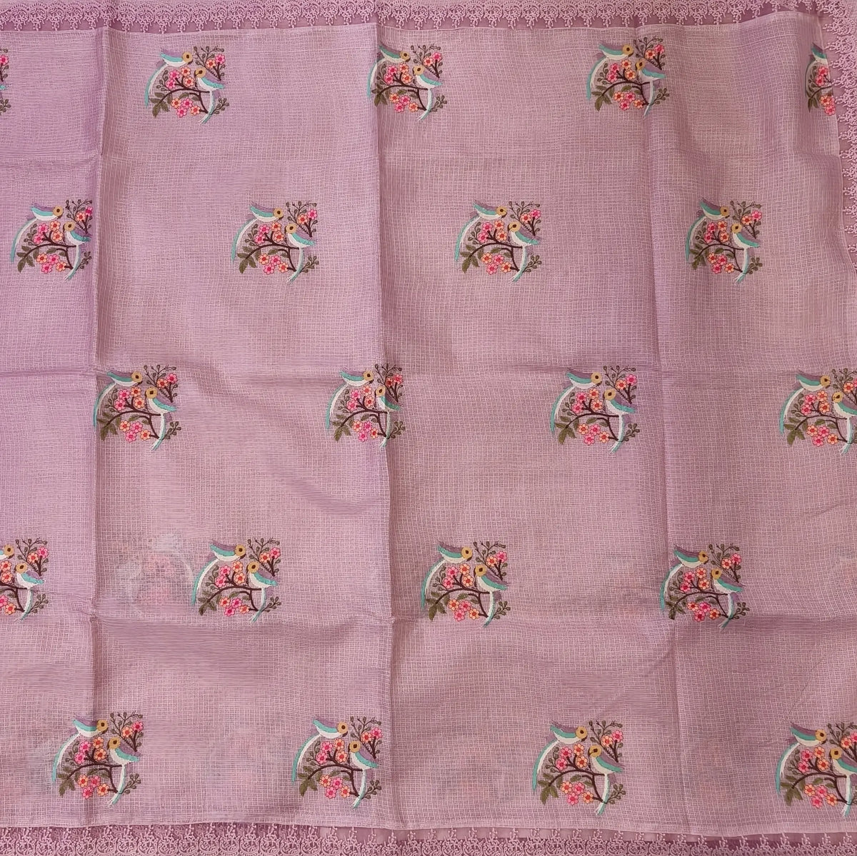 Pastel pink premium kota saree with embroidered bird and floral motifs all over (Thin, Lightweight) lace tapings as borders, rich embroidered pallu, plain running blouse. NS308