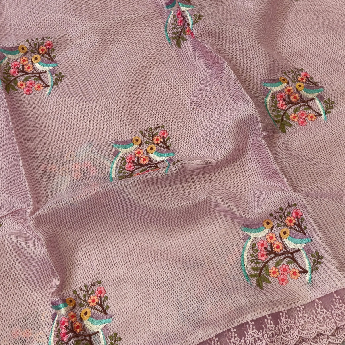 Pastel pink premium kota saree with embroidered bird and floral motifs all over (Thin, Lightweight) lace tapings as borders, rich embroidered pallu, plain running blouse. NS308