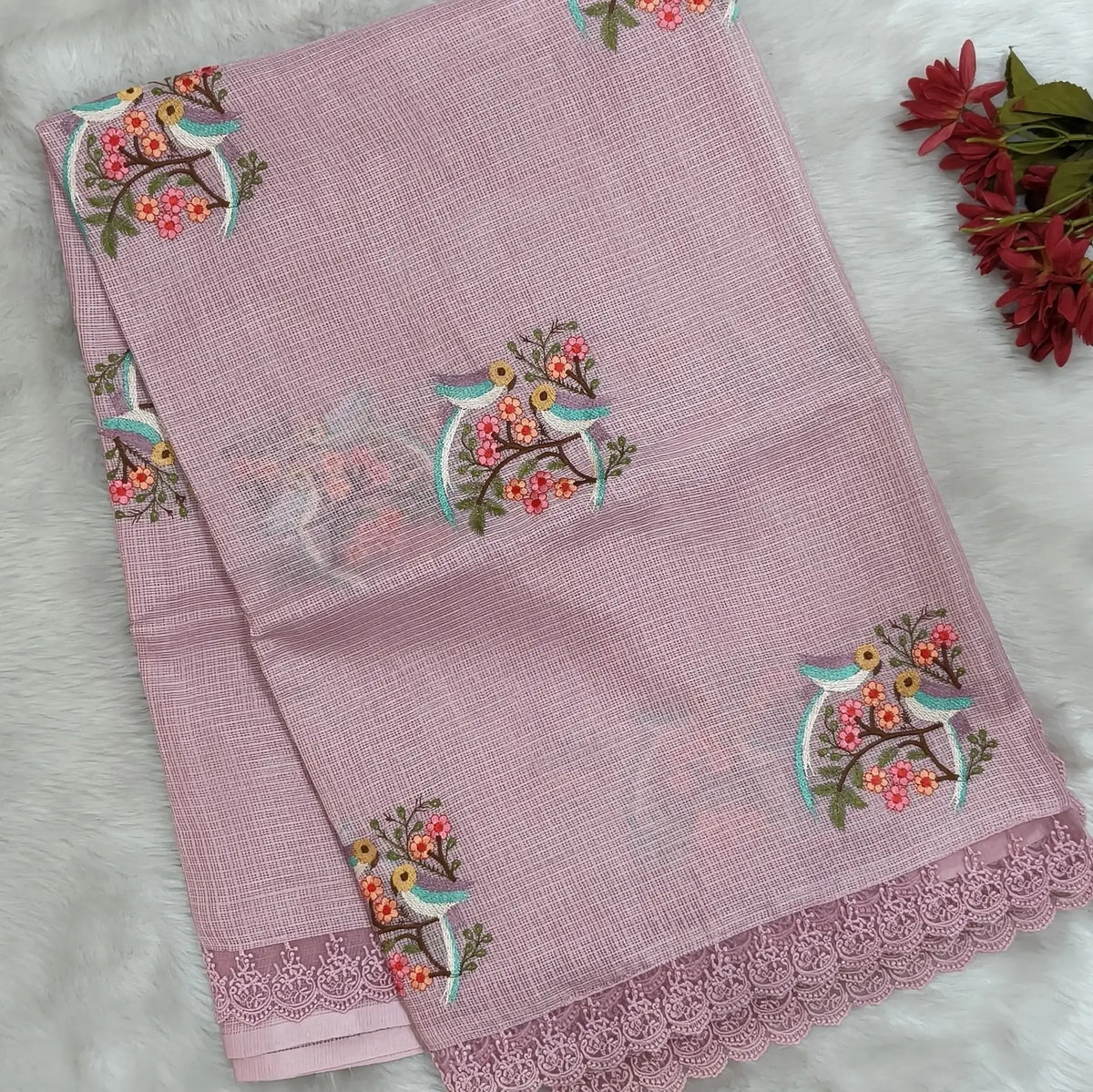 Pastel pink premium kota saree with embroidered bird and floral motifs all over (Thin, Lightweight) lace tapings as borders, rich embroidered pallu, plain running blouse. NS308