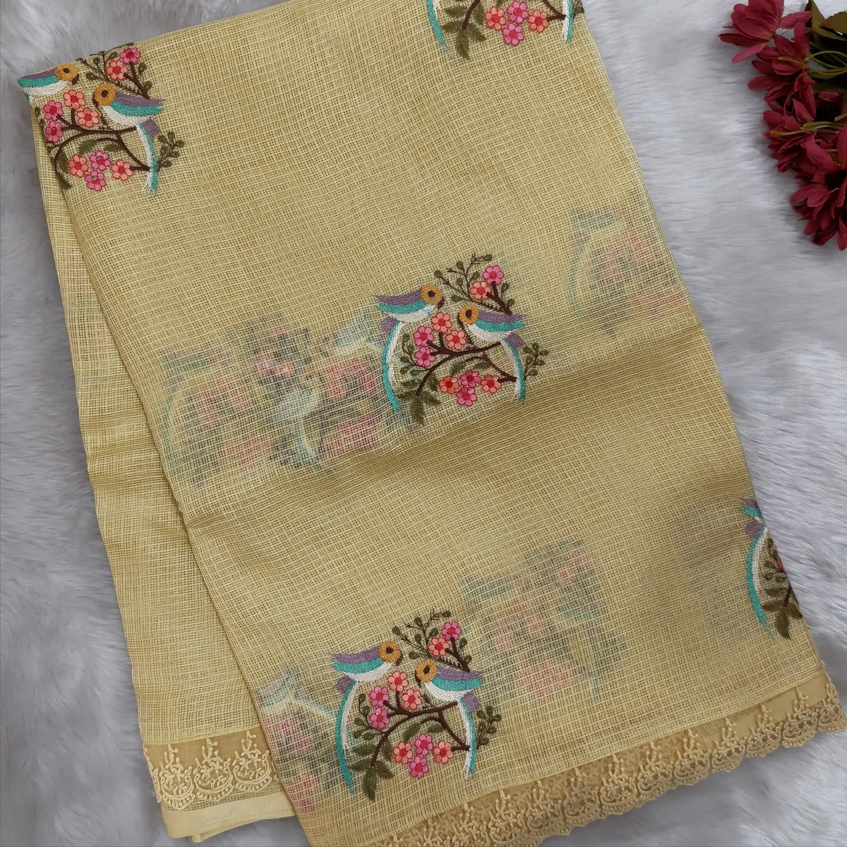 Pastel yellow premium kota saree with embroidered bird and floral motifs all over (Thin, Lightweight) lace tapings as borders, rich embroidered pallu, plain running blouse. NS307