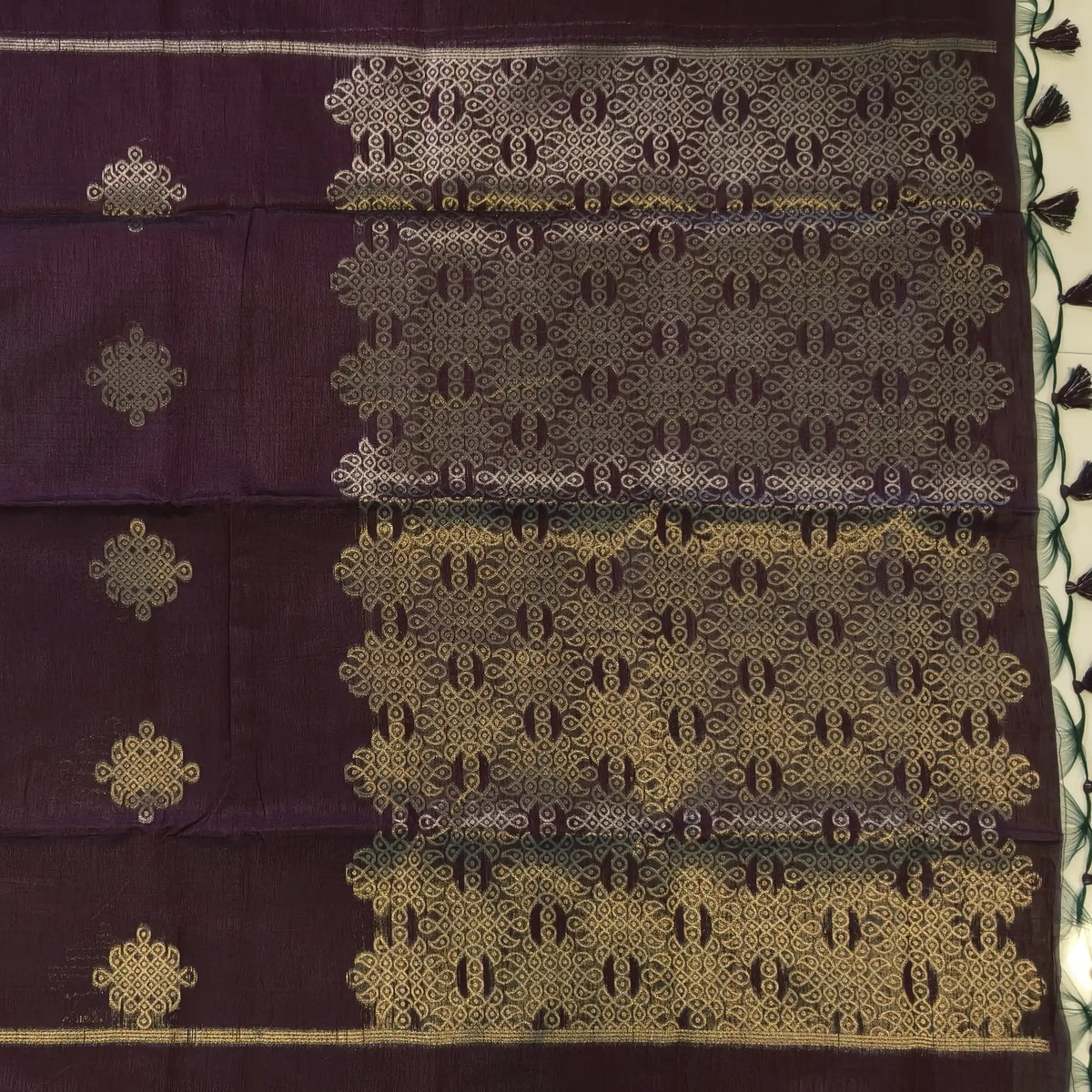 Dark brown semi tussar saree, with rich traditional zari weaving all over (thin, Textured) rich pallu, running blouse with zari woven buttas and borders. NS315