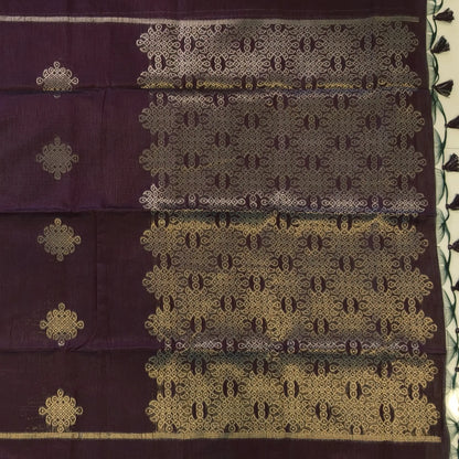 Dark brown semi tussar saree, with rich traditional zari weaving all over (thin, Textured) rich pallu, running blouse with zari woven buttas and borders. NS315