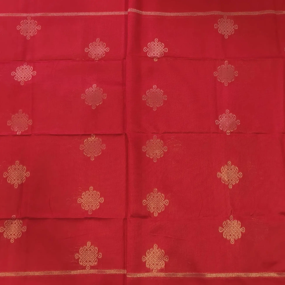 Red semi tussar saree, with rich traditional zari weaving all over (thin, Textured) rich pallu, running blouse with zari woven buttas and borders. NS311
