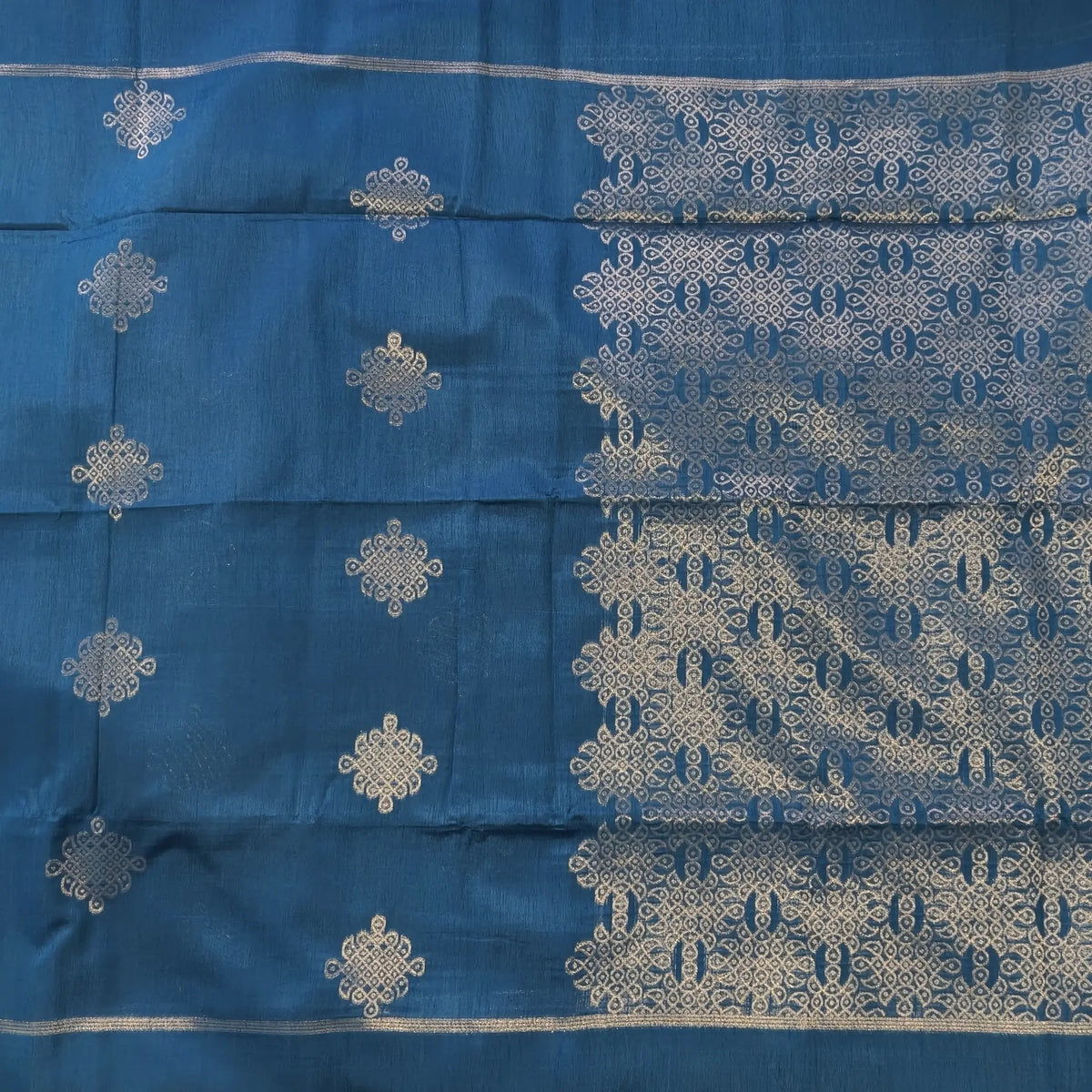 Dark turquoise blue semi tussar saree, with rich traditional zari weaving all over (thin, Textured) rich pallu, running blouse with zari woven buttas and borders. NS318