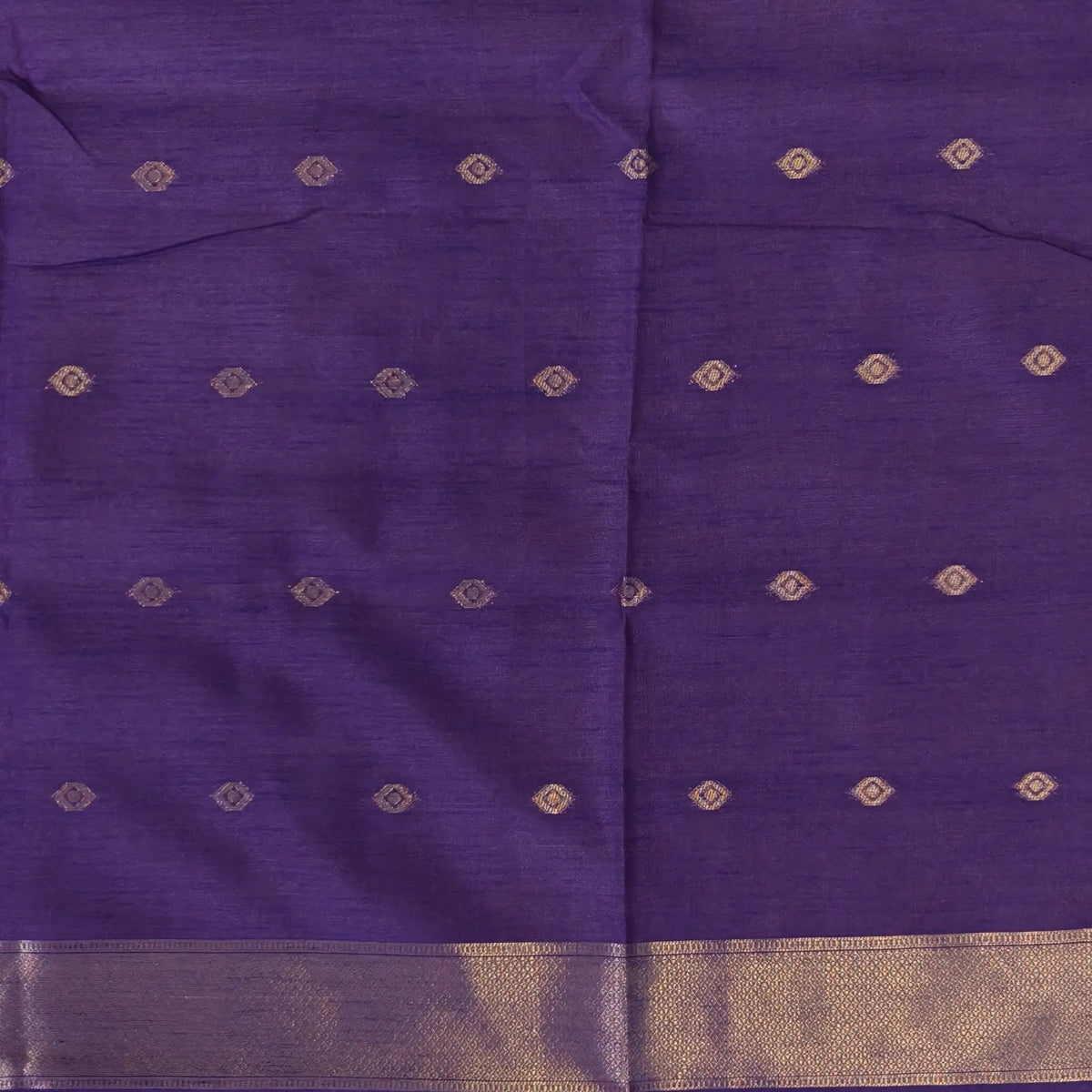 Purple semi tussar saree, with rich traditional zari weaving all over (thin, Textured) rich pallu, running blouse with zari woven buttas and borders. NS317