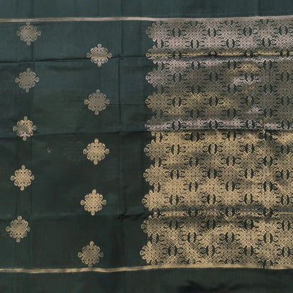 Dark green semi tussar saree, with rich traditional zari weaving all over (thin, Textured) rich pallu, running blouse with zari woven buttas and borders. NS314