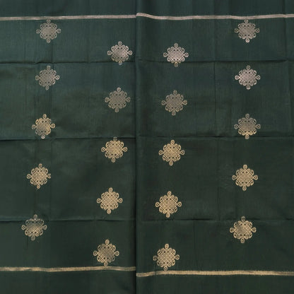 Dark green semi tussar saree, with rich traditional zari weaving all over (thin, Textured) rich pallu, running blouse with zari woven buttas and borders. NS314