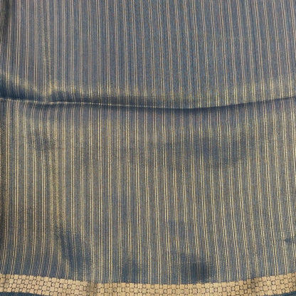 Dark teal blue viscous silk saree with zari buttas all over, thin double side zari borders (Thin, Soft) Striped pallu, zari and tissue striped running blouse. NS322