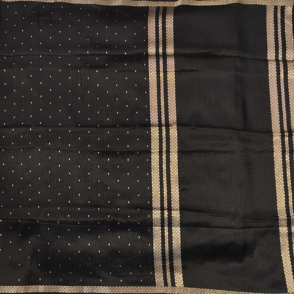 Black viscous silk saree with zari buttas all over, thin double side zari borders (Thin, Soft) Striped pallu, zari and tissue striped running blouse. NS319