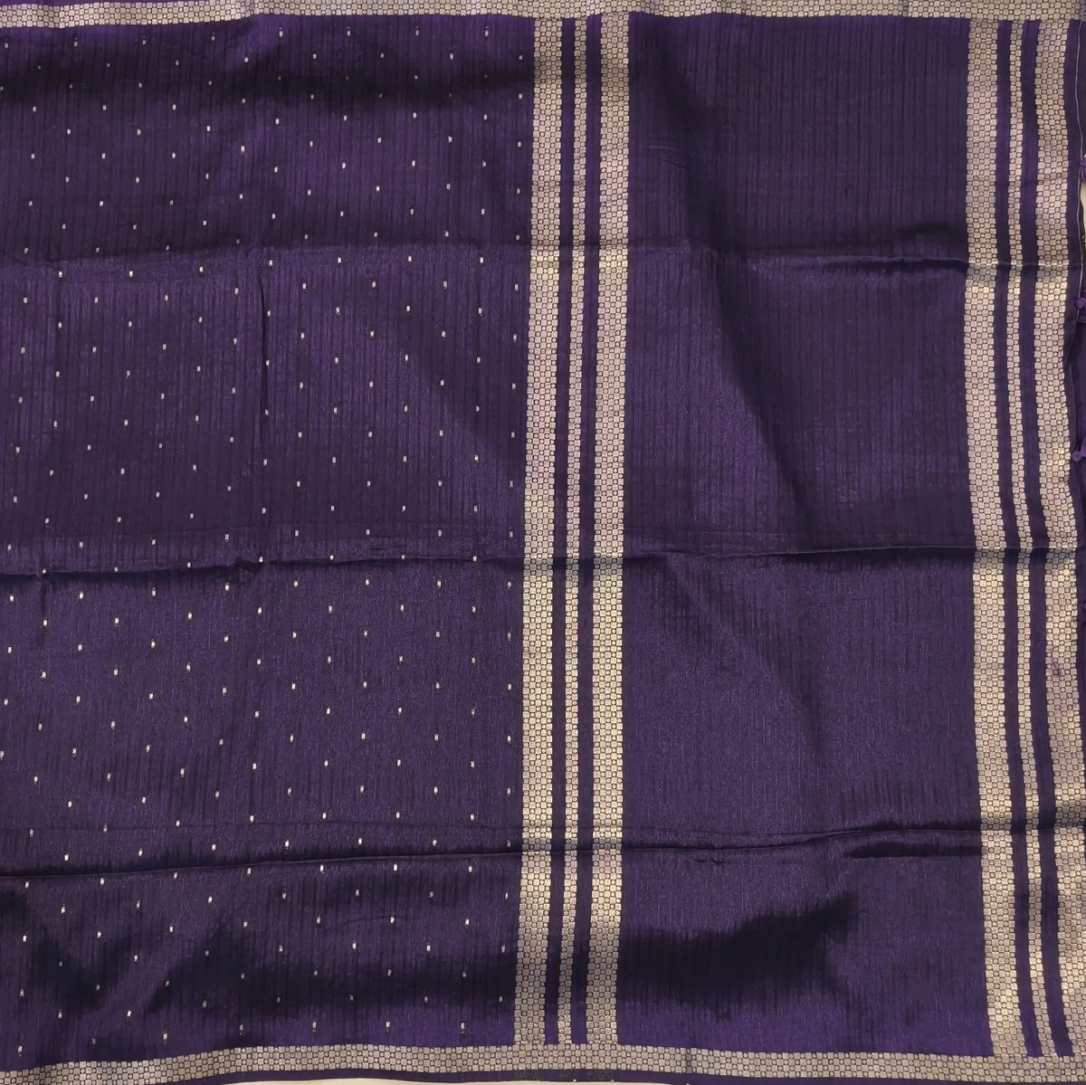 Dark purple viscous silk saree with zari buttas all over, thin double side zari borders (Thin, Soft) Striped pallu, zari and tissue striped running blouse. NS323
