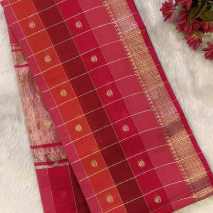 Multicoloured (Pink & red)soft silk cotton saree with zari woven checks & buttas all over, zari woven double side borders, tissue pallu,multicoloured running blouse with borders & buttas. NS26