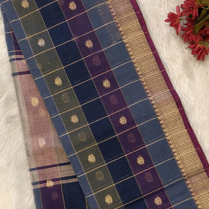 Multicoloured (Blue,purple & green)soft silk cotton saree with zari woven checks & buttas all over, zari woven double side borders, tissue pallu,multicoloured running blouse with borders & buttas. NS29