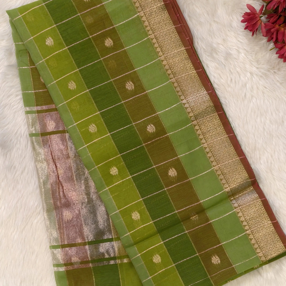 Multicoloured (Light & dark green)soft silk cotton saree with zari woven checks & buttas all over, zari woven double side borders, tissue pallu,multicoloured running blouse with borders & buttas. NS30
