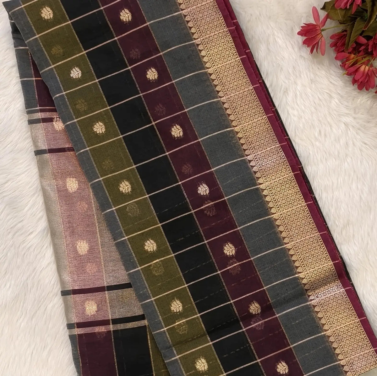 Multicoloured (Black, purple & grey)soft silk cotton saree with zari woven checks & buttas all over, zari woven double side borders, tissue pallu,multicoloured running blouse with borders & buttas. NS31