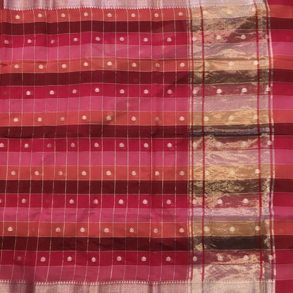 Multicoloured (Pink & red)soft silk cotton saree with zari woven checks & buttas all over, zari woven double side borders, tissue pallu,multicoloured running blouse with borders & buttas. NS26