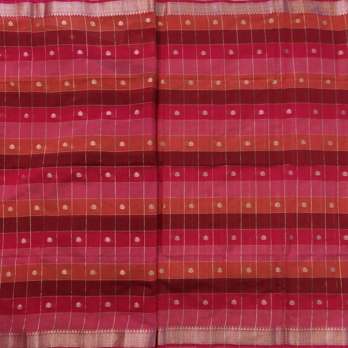 Multicoloured (Pink & red)soft silk cotton saree with zari woven checks & buttas all over, zari woven double side borders, tissue pallu,multicoloured running blouse with borders & buttas. NS26