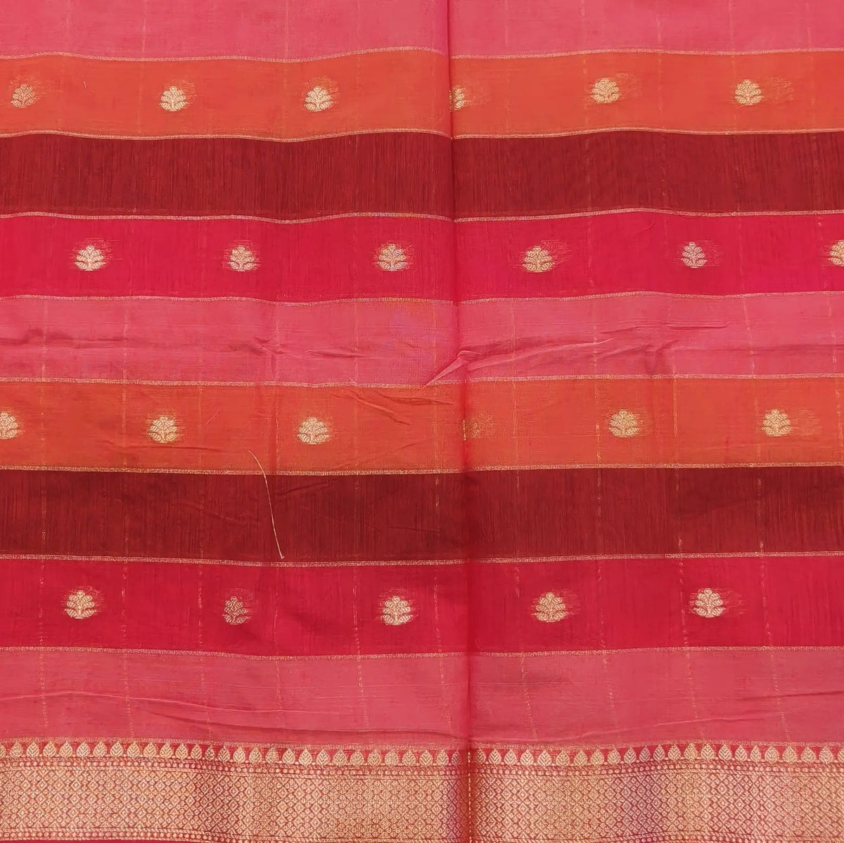 Multicoloured (Pink & red)soft silk cotton saree with zari woven checks & buttas all over, zari woven double side borders, tissue pallu,multicoloured running blouse with borders & buttas. NS26