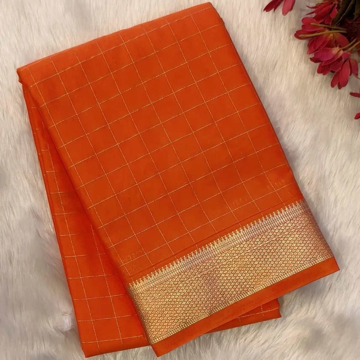 Orange soft fancy crepe silk saree,zari checks all over,(soft,thin)striped tissue pallu,double side zari woven borders,running blouse with zari checks and borders. NS245