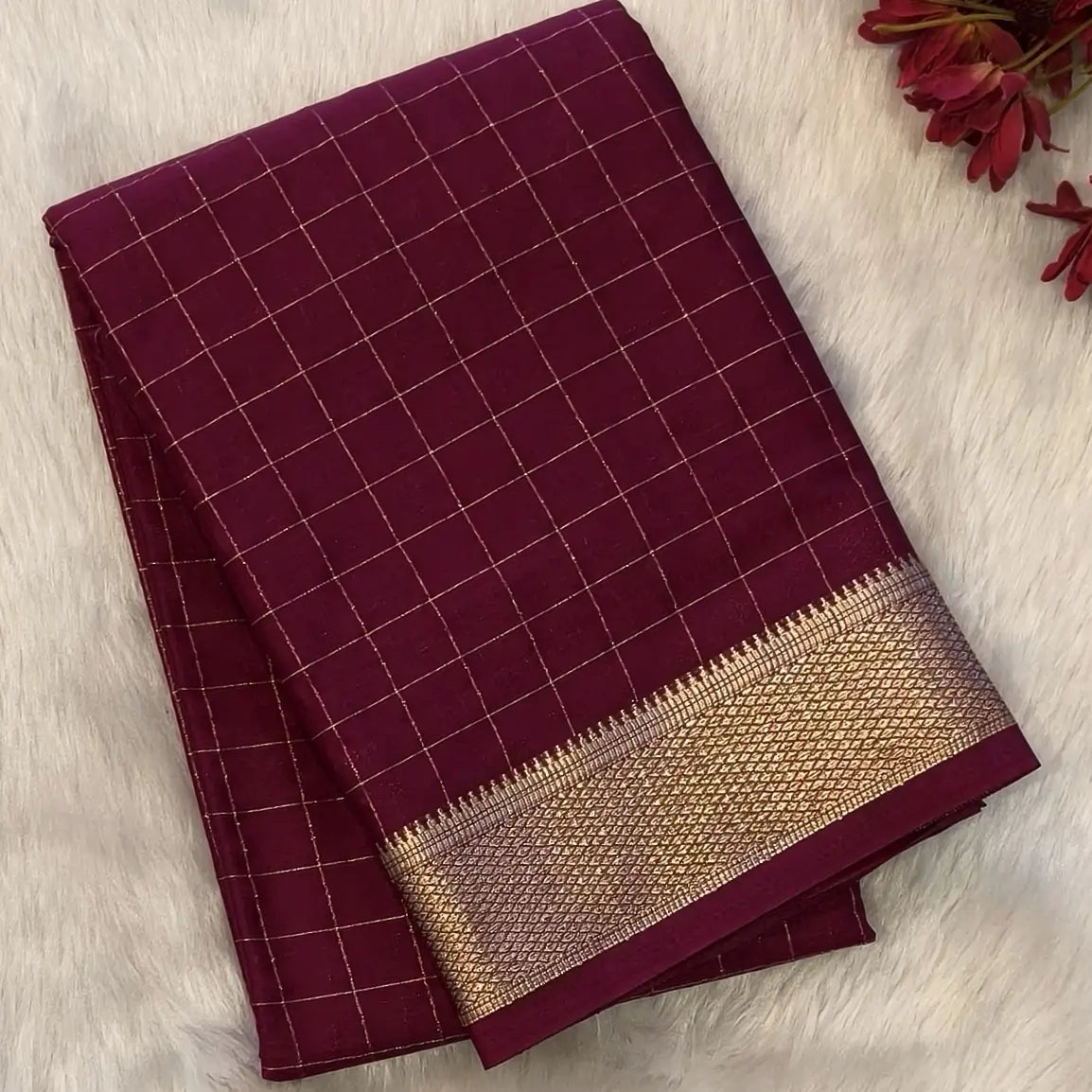 Dark beetroot purple soft fancy crepe silk saree,zari checks all over,(soft,thin)striped tissue pallu,double side zari woven borders,running blouse with zari checks and borders. NS344