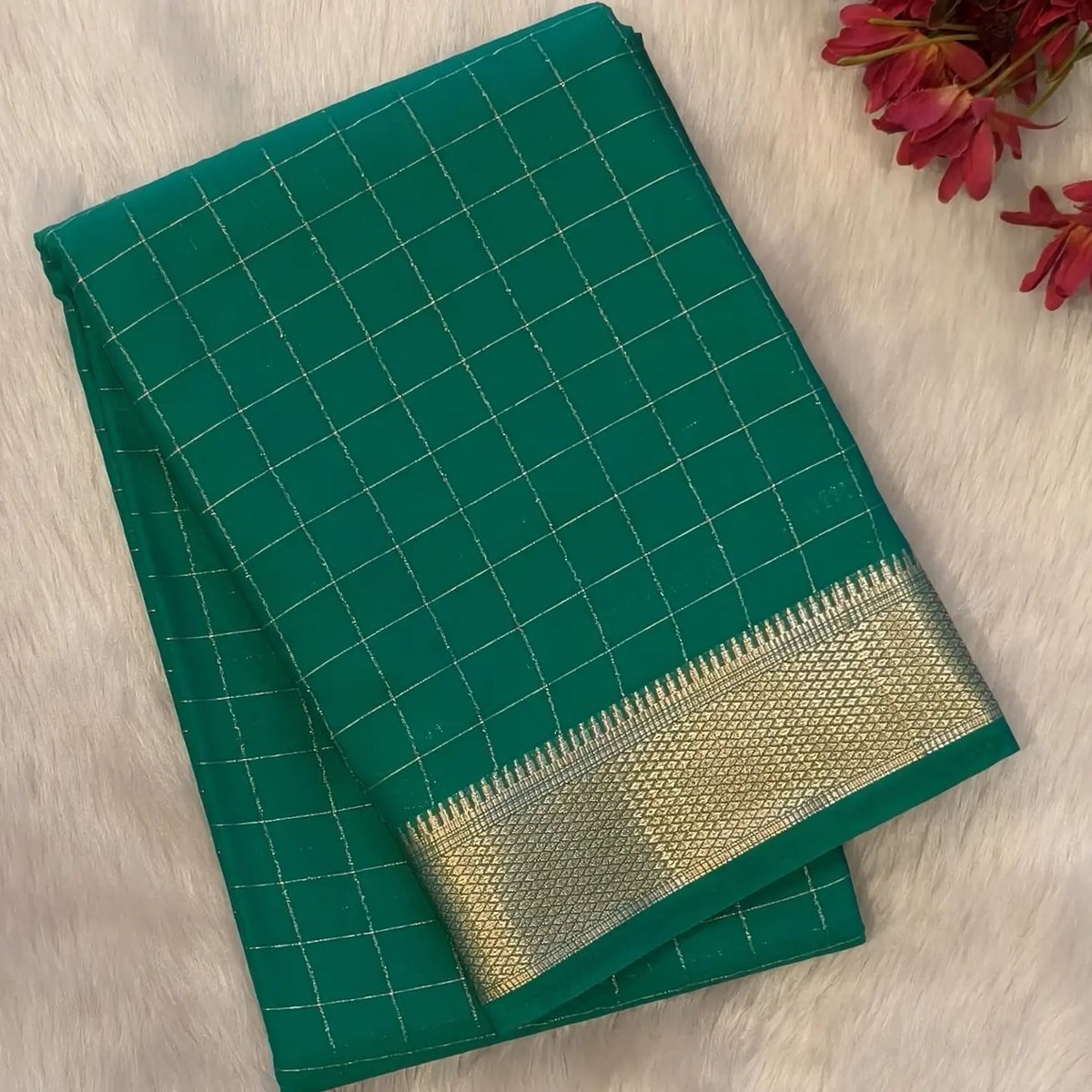 Dark turquiose green soft fancy crepe silk saree,zari checks all over,(soft,thin)striped tissue pallu,double side zari woven borders,running blouse with zari checks and borders. NS239