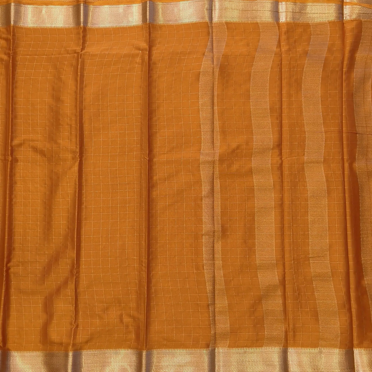 Fenugreek yellow soft fancy crepe silk saree,zari checks all over,(soft,thin)striped tissue pallu,double side zari woven borders,running blouse with zari checks and borders. NS242