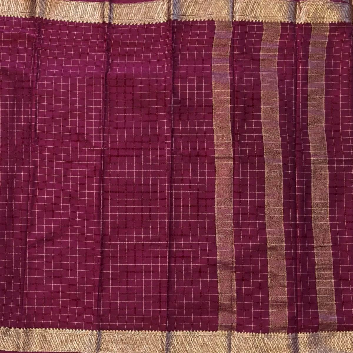Dark beetroot purple soft fancy crepe silk saree,zari checks all over,(soft,thin)striped tissue pallu,double side zari woven borders,running blouse with zari checks and borders. NS344