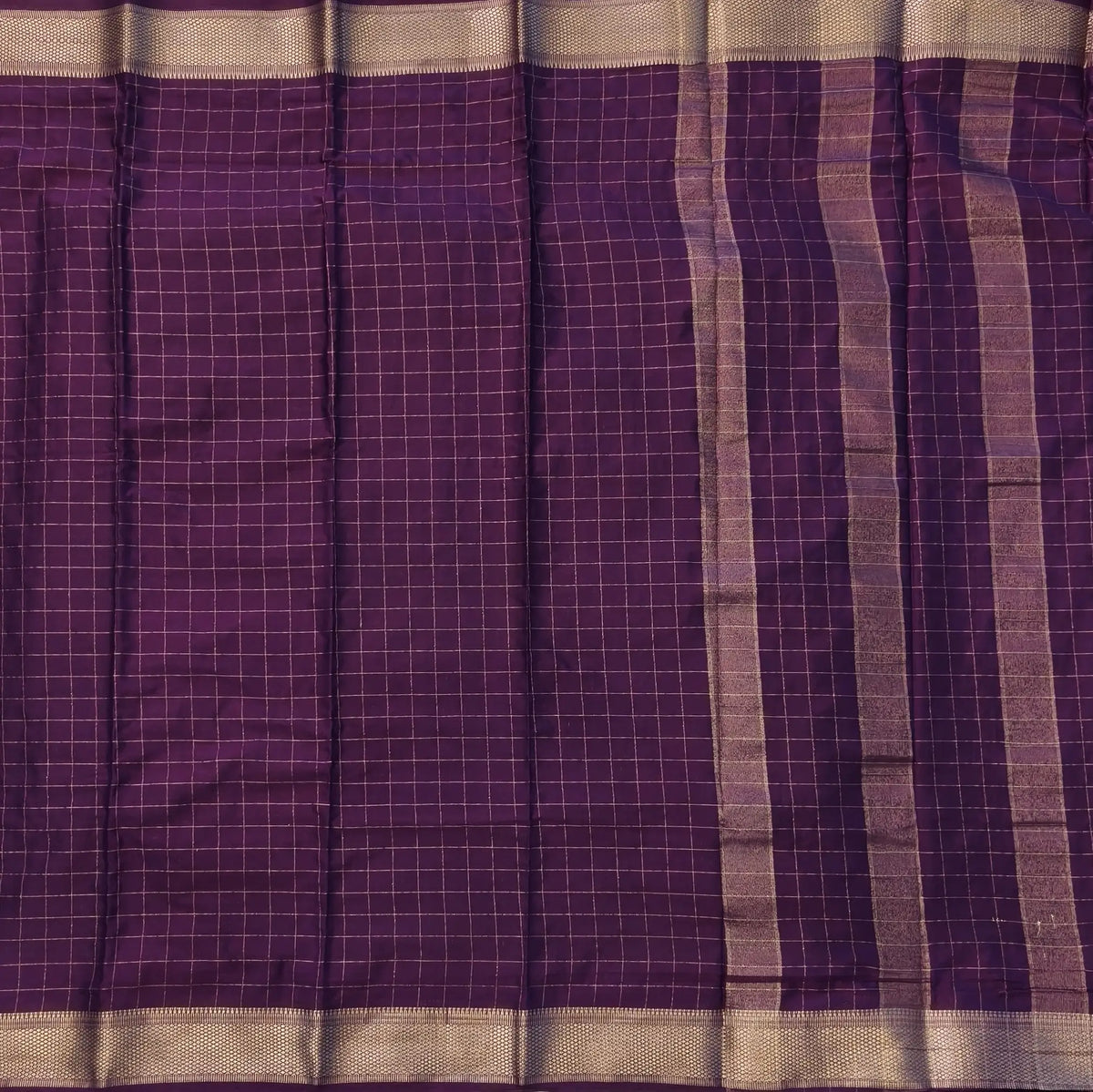 Wine purple soft fancy crepe silk saree,zari checks all over,(soft,thin)striped tissue pallu,double side zari woven borders,running blouse with zari checks and borders. NS241